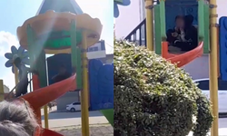 Çocuk parkı içinde sigara içen çocuklar kamerada