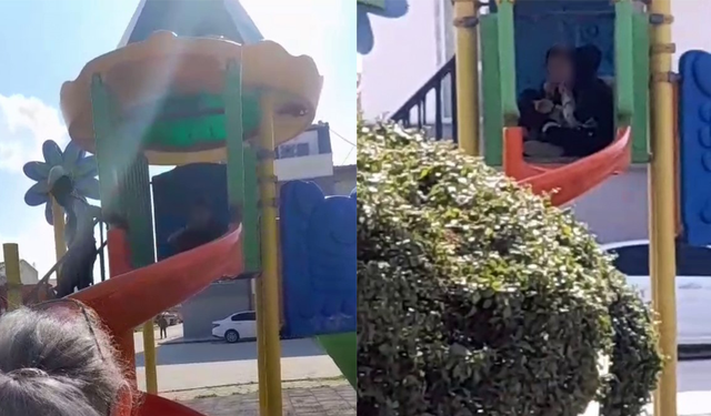 Çocuk parkı içinde sigara içen çocuklar kamerada